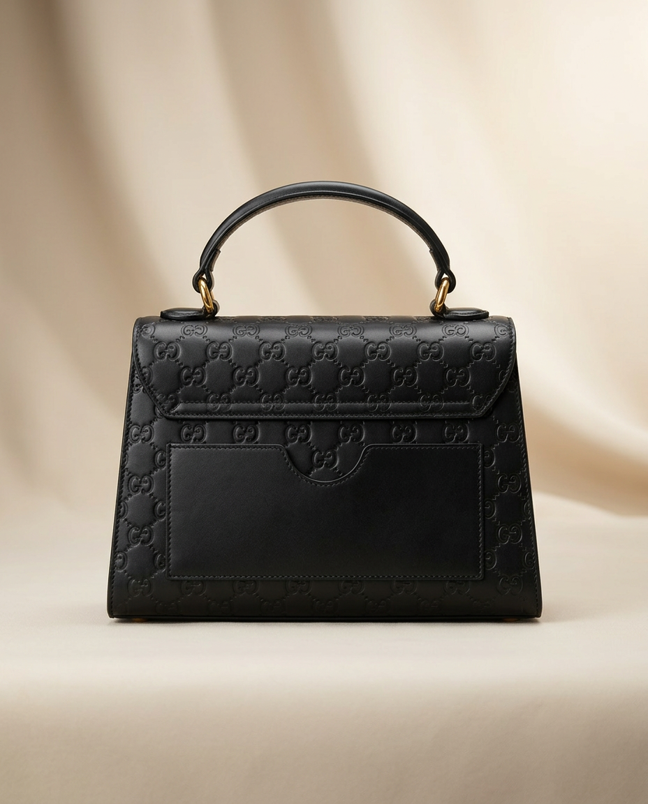 Gucci black GG embossed top handle bag top handle detail