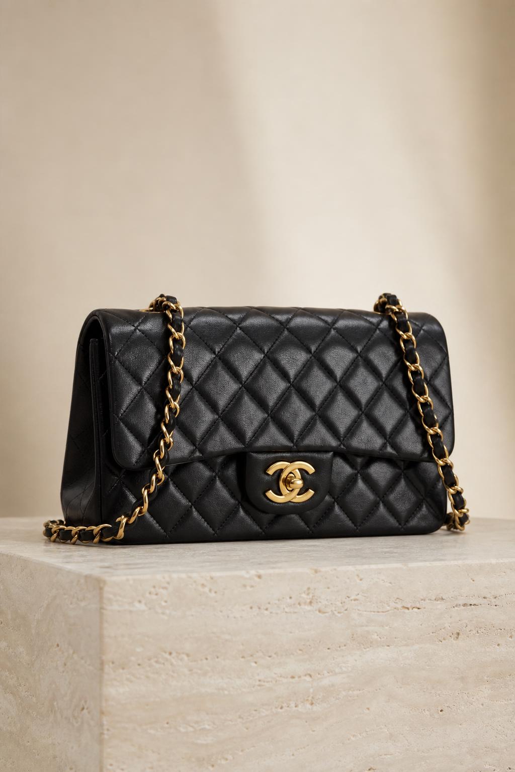 Chanel classic flap purse in quilted black lambskin with gold CC hardware, early 2000s collection